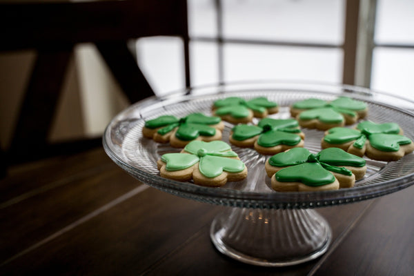 Green,Frosted,Shamrock,Cookies,On,Glass,Plate,In,Window,Light