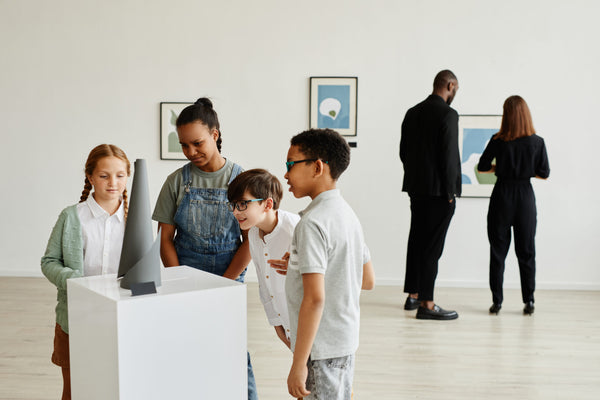 Multi-ethnic,Group,Of,Children,Looking,At,Sculptures,In,Modern,Art