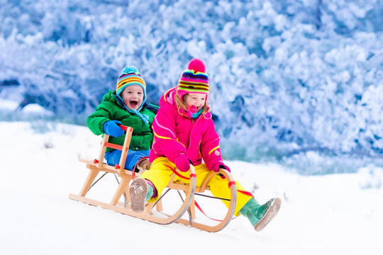 Little,Girl,And,Boy,Enjoy,A,Sleigh,Ride.,Child,Sledding.