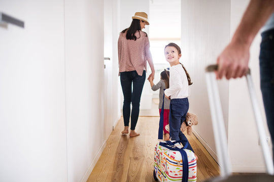 Young,Family,With,Two,Children,Going,On,A,Holiday.