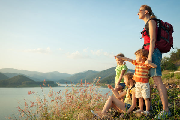 Happy,Family,Watching,The,Sunset,On,The,Lake