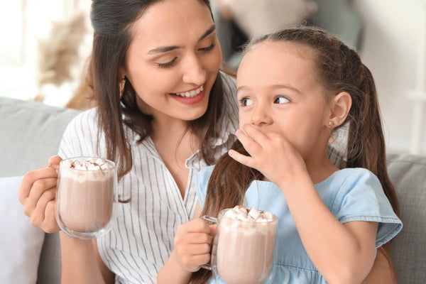 Woman,And,Her,Little,Daughter,Drinking,Tasty,Cocoa,At,Home