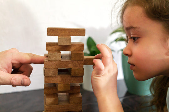 Father,And,Daughter,Playing,Game,Tumble,Tower,From,Wooden,Block