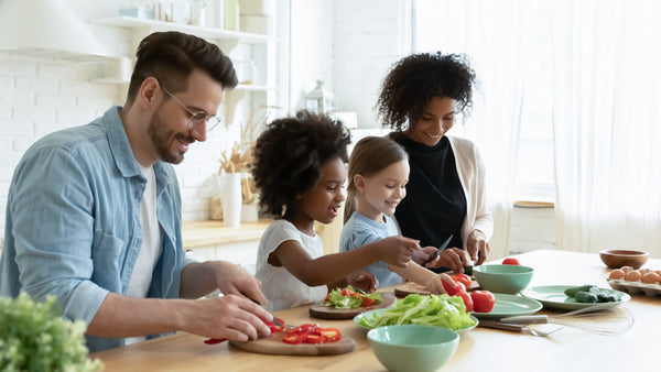 Full,Multinational,Family,With,Cute,Daughters,Preparing,Dietary,Meal,Natural
