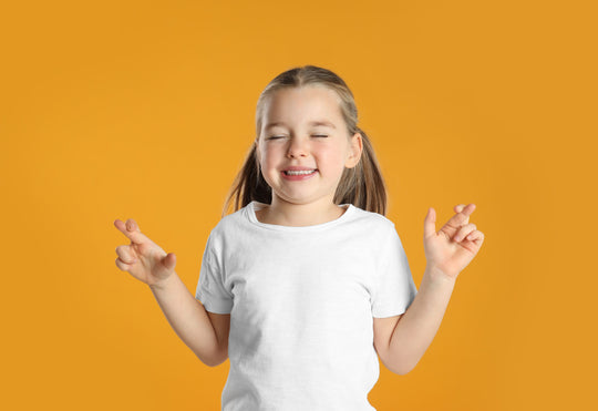 Child,With,Crossed,Fingers,On,Yellow,Background.,Superstition,Concept