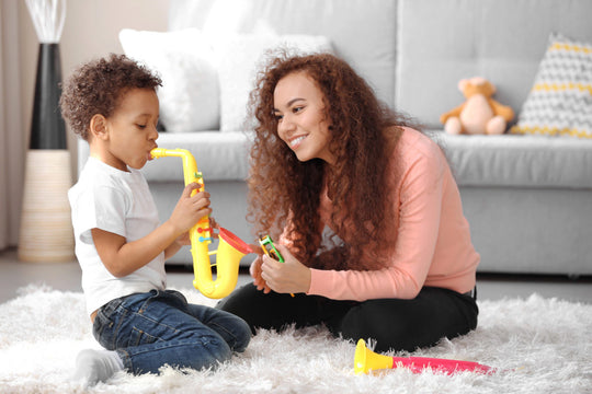 Little,Boy,And,A,Young,Girl,Playing,With,Musical,Toys
