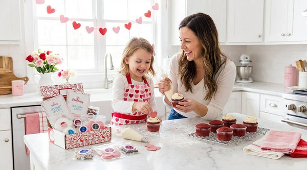Child baking Valentine’s treats with family in a warm home kitchen